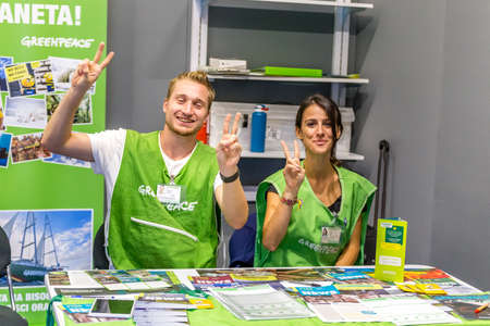 BOLOGNA (ITALY), SEPTEMBER 10, 2018: Booth presenter awaiting visitors to give information about the...