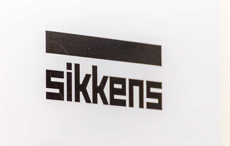 LUGO (RA), ITALY â€“ SEPTEMBER 11, 2018: Dust and dirt covering the logo SIKKENS on signboard