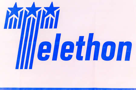 LUGO (RA), ITALY â€“ SEPTEMBER 11, 2018: Dust and dirt covering the  TELETHON logo on fabric...