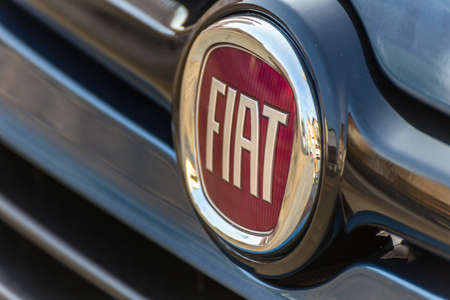 LUGO, ITALY - September 11, 2018: light enlightening FIAT logo on a car body