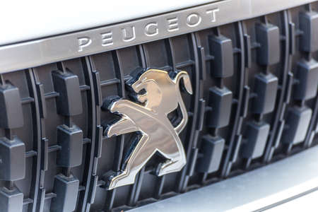 LUGO, ITALY - September 11, 2018: light enlightening Peugeot logo on a car bodyのeditorial素材