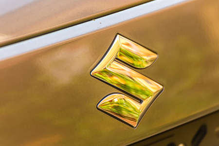 LUGO, ITALY - September 11, 2018: light enlightening SUZUKI logo on a car body