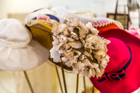 CESENA (FC), ITALY - SEPTEMBER 16, 2018: lights enlightening vintage hats at antiques fair in Cesenaのeditorial素材