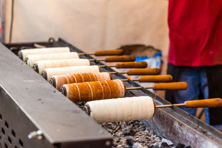 Hungarian Chimney cakes on top of hot coals in street market