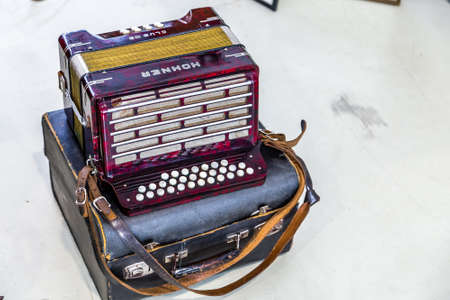 CESENA (FC), ITALY - SEPTEMBER 16, 2018: dust and dirt covering  old accordion at antiques fair in...