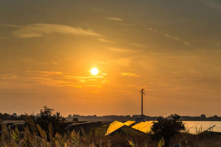 sunset on photovoltaic panels in countrysideの写真素材