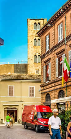 RAVENNA, ITALY - SEPTEMBER 19, 2018:  light enlightening BRT logo on red van in historical center of Ravennaのeditorial素材