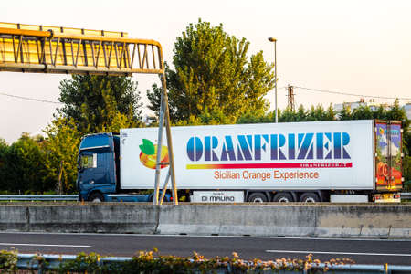 FAENZA (RA), ITALY - SEPTEMBER 20, 2018: truck with  ORANFRIZER logo running on highway