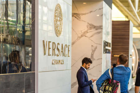 BOLOGNA (ITALY), SEPTEMBER 26, 2018: light is enlightening VERSACE logo at CERSAIE, international exhibition of ceramic tile and bathroom furnishingsのeditorial素材