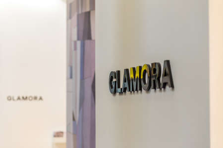 BOLOGNA (ITALY), SEPTEMBER 26, 2018: light is enlightening GLAMORA logo at CERSAIE, international...