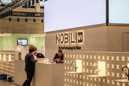 BOLOGNA (ITALY), SEPTEMBER 28, 2018: booth presenters waiting for visitors at NOBILI stand at ...