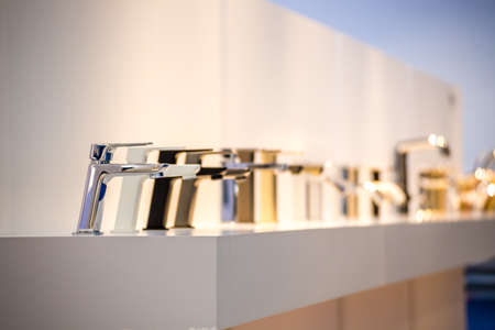 row of modern chrome faucetsのeditorial素材