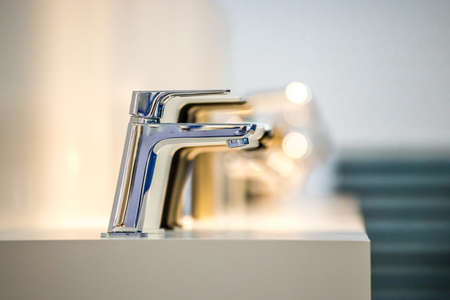 row of modern chrome faucetsのeditorial素材