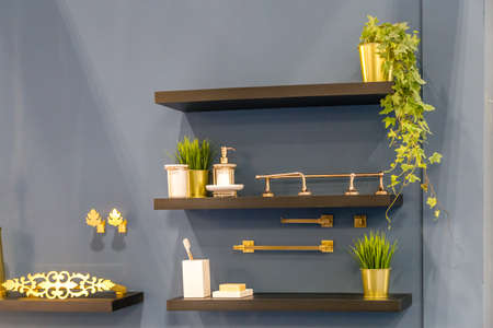 bathroom golden accessories on shelvesのeditorial素材