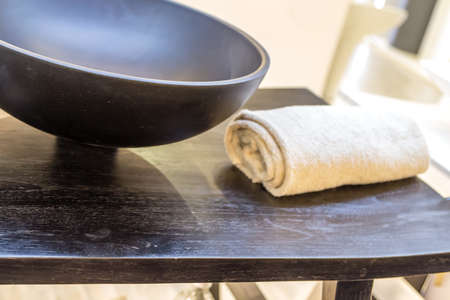 white cream towel near black ceramic sinkのeditorial素材