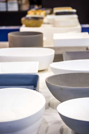 closeup of rows of modern ceramic washbasinsのeditorial素材