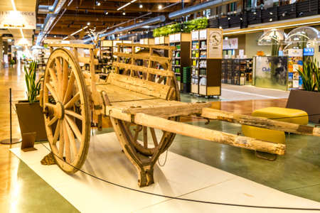 BOLOGNA, ITALY - OCTOBER 2, 2018: lights are enlightening Old wooden wagon at FICO EATALY WORLD, the largest agri-food park in the worldのeditorial素材