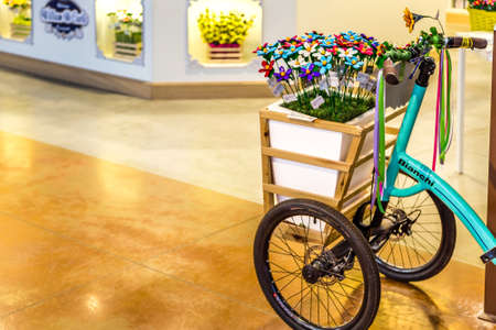 BOLOGNA, ITALY - OCTOBER 2, 2018: lights are enlightening vintage BIANCHI bicycles with shopping basket at FICO EATALY WORLD, the largest agri-food park in the worldのeditorial素材