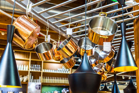 BOLOGNA, ITALY - OCTOBER 2, 2018: lights are enlightening hanging Ruffoni Copper cookware at FICO EATALY WORLD, the largest agri-food park in the worldのeditorial素材