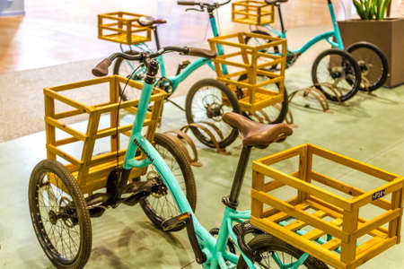 BOLOGNA, ITALY - OCTOBER 2, 2018: lights are enlightening vintage BIANCHI bicycles with shopping basket at FICO EATALY WORLD, the largest agri-food park in the worldのeditorial素材