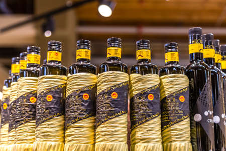 BOLOGNA, ITALY - OCTOBER 2, 2018: lights are enlightening bottles of extra virgin olive oil at FICO EATALY WORLD, the largest agri-food park in the worldのeditorial素材