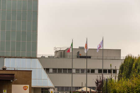 San Polo di Torrile, Italy - October 12, 2018:  GSK, Italian and VIIV flags waving together on plant for Fostemsavir, innovative anti-HIV drug on the day of the inaugurationのeditorial素材