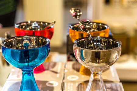 BOLOGNA, ITALY - OCTOBER 2, 2018: lights are enlightening Plastic and steel cups for dessert  at FICO EATALY WORLD, the largest agri-food park in the worldのeditorial素材
