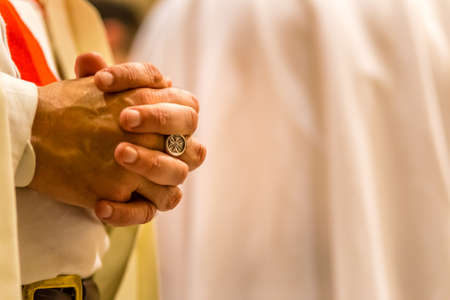 FORLI, ITALY - OCTOBER 26, 2018: Catholic Templar Knights participate in the ritual of Holy Mass. Hands of Magister Mauro Giorgio Ferrettiのeditorial素材