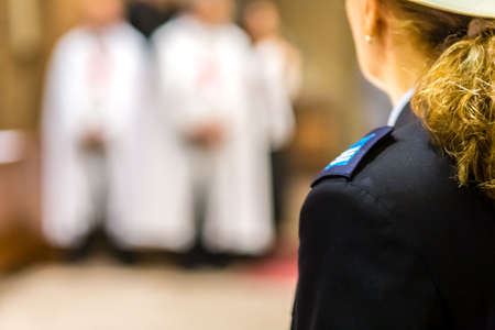 Back of the helmet of a female  policeman of the Italian municipal police at a ceremony