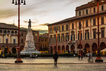FORLI, ITALY - OCTOBER 26, 2018: people walking in Piazza Saffi under winter sunsetのeditorial素材