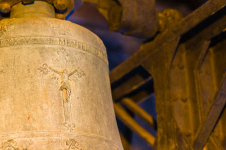 Crucifixion of Jesus Christ on ancient bronze bell in tower