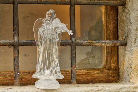 PORTICO (FC), ITALY - DECEMBER 20, 2017: light is enlightening crystal glass statue of angel in Nativity Sceneのeditorial素材