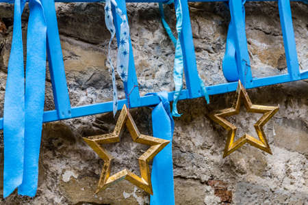yellow Christmas stars on old wall background