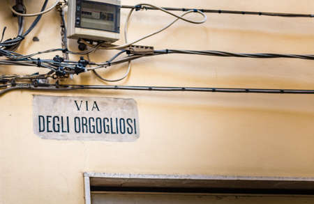 street with Italian sign meaning street of the proudの写真素材