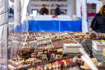 RAVENNA, ITALY - NOVEMBER 9, 2018: sunlight is enlightening several variations of shape, texture, colour, flavour and recipe of chocolate at Art & Ciocc, the XI Tour of chocolate makersのeditorial素材