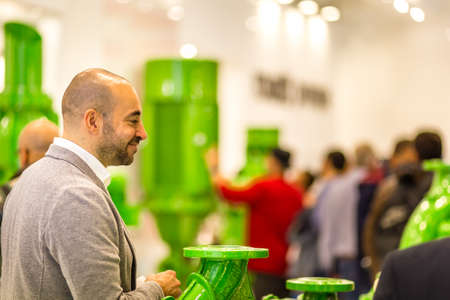 BOLOGNA, ITALY â NOVEMBER 10, 2018: booth presenter waiting for visitors at EIMA 2018,  International Agricultural and Gardening Machinery Exhibitionのeditorial素材