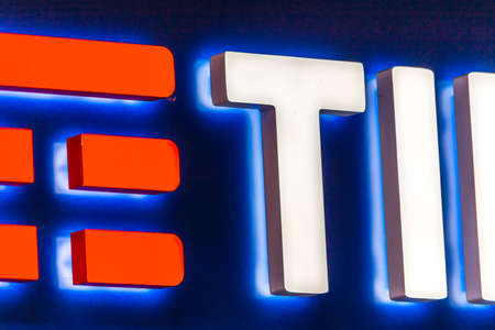 RAVENNA, ITALY - SEPTEMBER 12, 2018: light is enlightening TIM logo on storefrontのeditorial素材