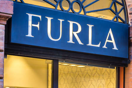 RAVENNA, ITALY - SEPTEMBER 12, 2018: light is enlightening FURLA logo on storefrontのeditorial素材
