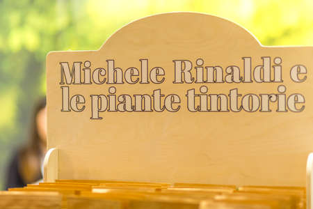 BOLOGNA, ITALY - NOVEMBER 25, 2018: Lights are enlightening Michele Rinaldi hairstylist signboard.