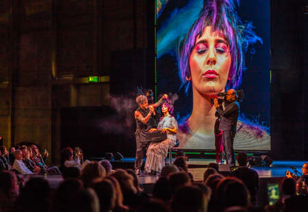 BOLOGNA, ITALY - NOVEMBER 25, 2018: Hairstylist Rudy Mostarda performs hairstyle show on catwalk in theatre.のeditorial素材