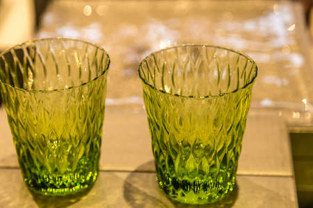background of artistic  green Glasses on table