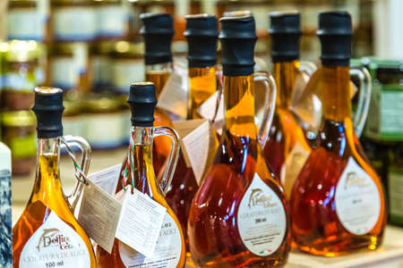 BOLOGNA, ITALY - OCTOBER 2, 2018: lights are enlightening bottles of extract of anchovies at FICO EATALY WORLD, the largest agri-food park in the worldのeditorial素材