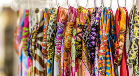 Colorful scarves hanging from rack