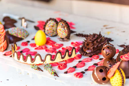 ornaments and pieces of chocolate on the counter of a pastry chefの写真素材