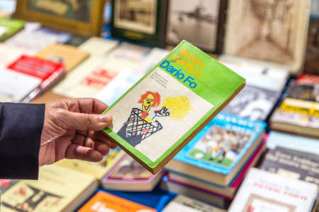 CESENA, ITALY - NOVEMBER 18, 2018: lights are enlightening old books for sale in Antiques Fairのeditorial素材