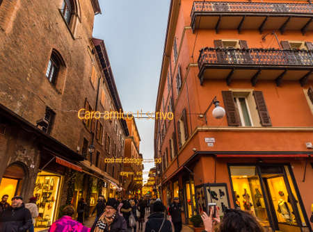 BOLOGNA, ITALY - DECEMBER 10, 2018: tourists taking photos of Christmas lights celebrating famous singer Lucio Dalla with lyrics of his song in D Azeglio street in Bolognaのeditorial素材