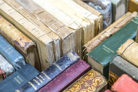 CESENA, ITALY - NOVEMBER 18, 2018: lights are enlightening old books for sale in Antiques Fairのeditorial素材