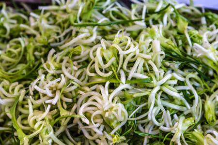 sliced zucchini for sale in market stallの写真素材