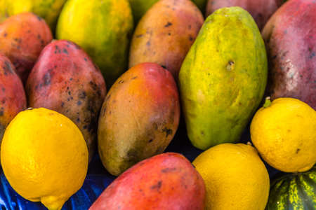 papayas for sale in market stallの写真素材
