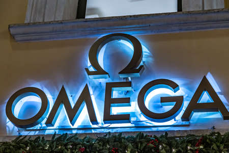 ROME, ITALY - JANUARY 3, 2019: lights are enlightening  OMEGA logo on storefront at night